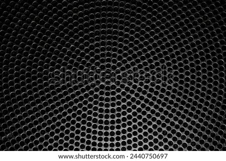 Extremely impressive abstract black and white close-up of a symmetrical hole pattern covering the entire image. Suitable as a background image. GoranOfSweden