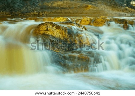 Silk effect of a river surrounding a rock