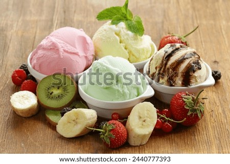 #Variety of ice cream scoops in cones with chocolate, vanilla and strawberry