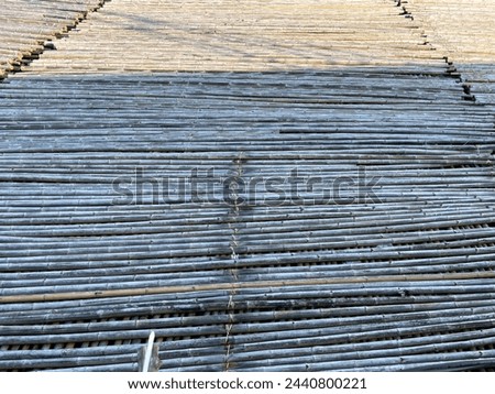Banten, Indonesia-March 22 2024: rows of bamboo on the water for workers to walk through