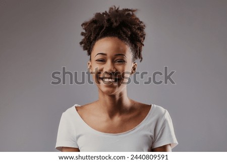 Effervescence captured in her grin, eyes sparkling with vivacious energy Royalty-Free Stock Photo #2440809591