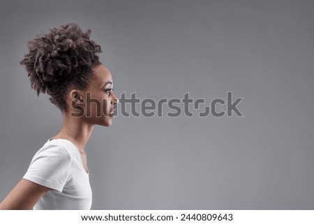 Elegant woman captured in profile, symbolizing thoughtful introspection and determined poise