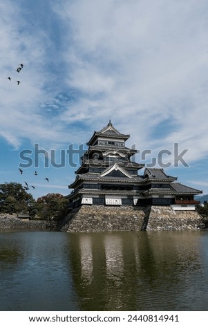 The picture displays Matsumoto Castle, an iconic Japanese stronghold characterized by its striking black and white exterior.