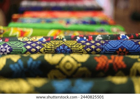 Beautiful and colorful Batik clothes in stores. Indonesian culture and craft.