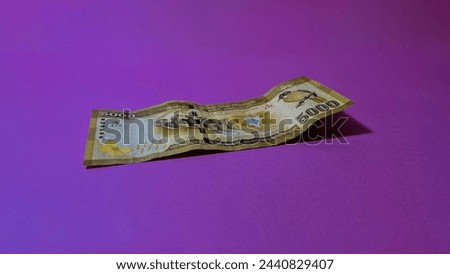 Sri Lankan rupees 5000 note on pink background