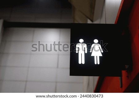 Public restroom signs for men and women
