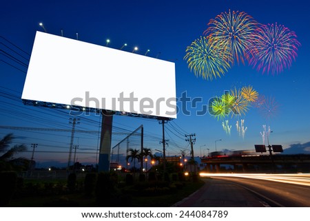 Blank billboard at night with fireworks 