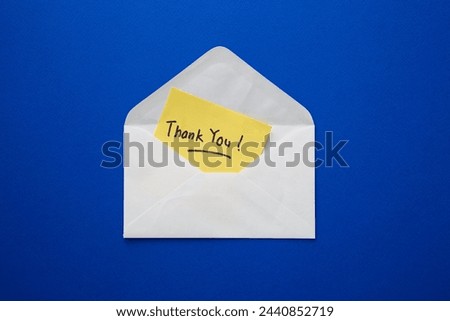 Thank you note on yellow paper in an envelope. Thank you message