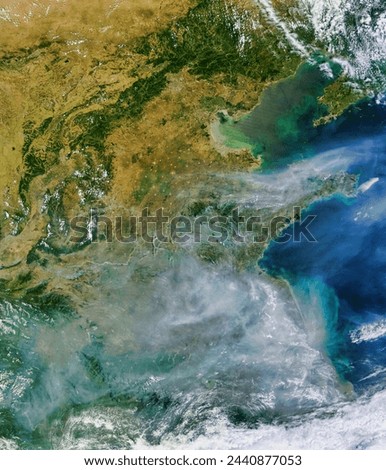 Fires and Smoke in Eastern China. Acquired July 6, 2010, this naturalcolor image shows fires marked by red dots and thick smoke plumes. Elements of this image furnished by NASA.