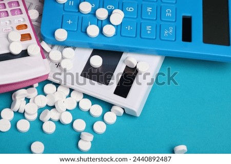 Many different calculators with pills on a blue background