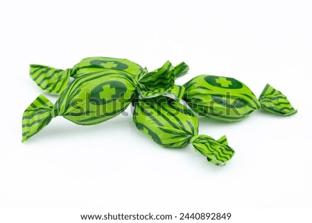 heap of herbal candies on white background. fresh breath concept 