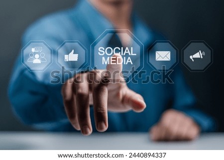 Social media network community concept. Person touching social media icons on virtual screen.