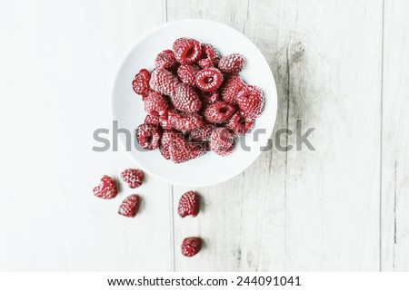 Retro Photo Of Raspberry Bowl Full Of Fresh Red Raspberries