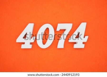 Orange felt is the background. The numbers 4074 are made from white painted wood.