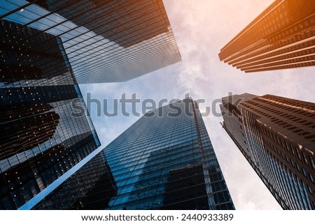 tall skyscrapers buildings looking up perspective, modern architecture of steel and glass, skyline of big city