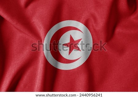 National Flag on Textured Fabric Background. Silk textured flag, realistic wave and flag look. TN  Flag of Tunisia