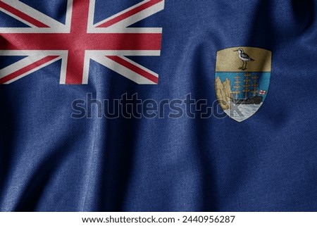 National Flag on Textured Fabric Background. Silk textured flag, realistic wave and flag look. SH  Flag of Saint Helena