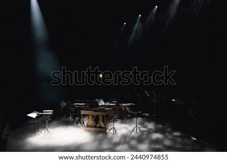 Stage before a classical concert with simple white lighting in dark