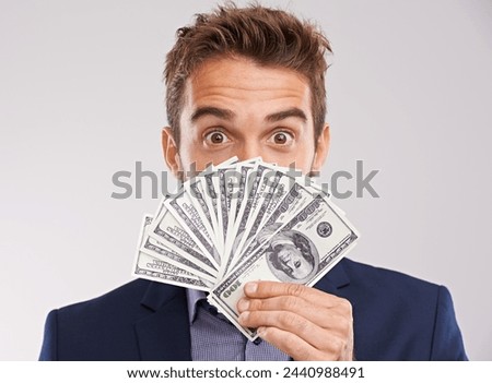 Face, man and money for investment in studio on white background with cash for business and funding. Portrait, happy and entrepreneur with paper notes or finance for startup company and growth