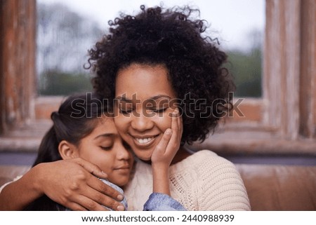 Mother, child and hug on sofa in home for weekend relaxing or holiday bonding, love or support. Woman, daughter and embrace connection in apartment living room for vacation care, youth or parenting