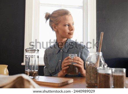 Woman, thinking and herbal tea to relax in home and warm beverage of herbs mixture for health. Happy, designer and creative idea for dried leaves in plunger and wellness for detox drink in mason jar