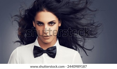Hair care, bow tie or portrait of fashion model in studio with vintage clothes, makeup or classy aesthetic. Face, gothic or woman with retro style, elegance or confidence isolated on grey background