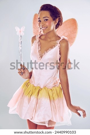 Woman, fairy and costume with wand in studio portrait for magic with smile by white background. Person, model or girl with fantasy, fairytale and butterfly wings for surreal story, art and creativity