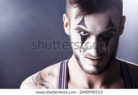Face, man and mime for circus performance on dark background with light for stage, creativity and entertainment. Portrait, mime and performer with face paint or tattoo for show and creativity