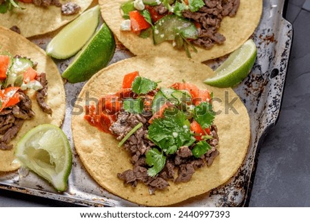 Close-Up 4K Ultra HD Image of Corn Tostada with Beef and Tomato - Stock Photography