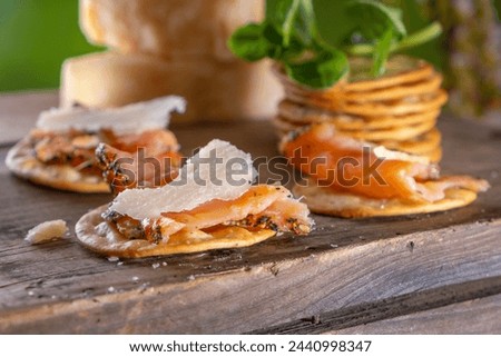 Close-Up 4K Ultra HD Image of Crackers with Smoked Salmon and Cheese - Stock Photography
