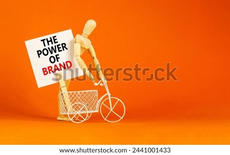 The power of brand symbol. Concept words The power of brand on beautiful white paper on clothespin. Businessman model. Beautiful orange background. Business the power of brand concept. Copy space.