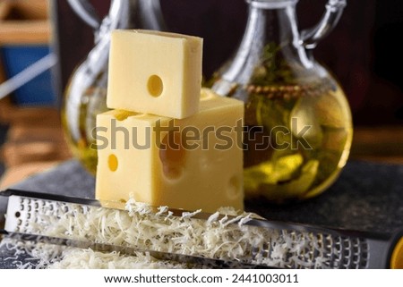 Close-Up 4K Ultra HD Image of Grating Cheese - Stock Photography
