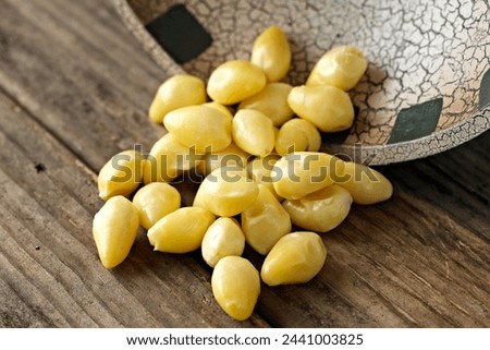 Close-Up 4K Ultra HD Image of Ginkgo Nuts on Wooden Table - Stock Photography