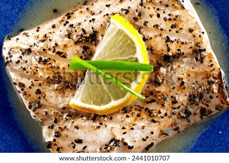 Close-Up 4K Ultra HD Image of Grilled Mahi with Lemon Sauce - Stock Photography