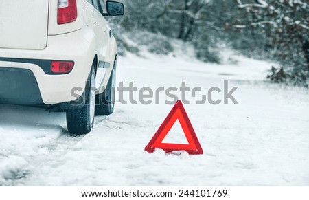 Emergency stop car on winter road in the countryside.