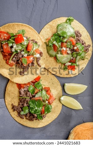 Close-Up 4K Ultra HD Image of Corn Tostada with Beef and Tomato - Stock Photography
