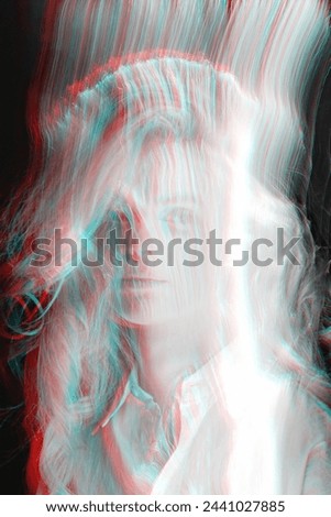 Abstract beautiful woman silhouette in bright light trails of light painting technique. Red and blue color split effect style. Long exposure photo. Image contains noise and motion blur