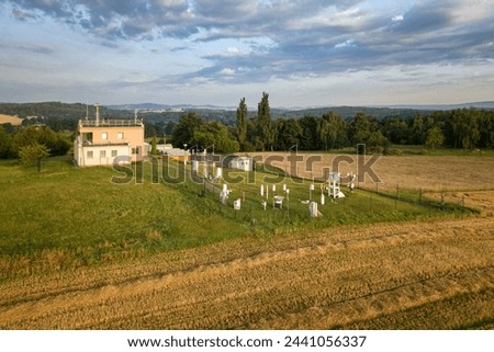 A weather station is a facility, either on land or sea, with instruments and equipment for measuring atmospheric conditions - Czech metrology institute, weather station Kocelovice. Royalty-Free Stock Photo #2441056337