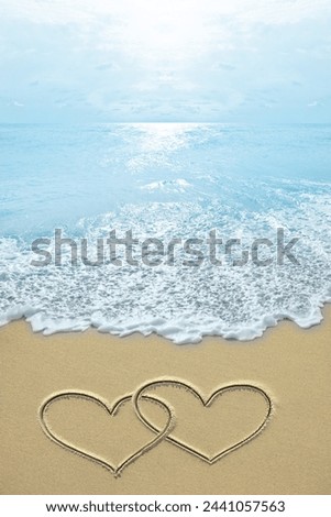 symbol image of the opening tourist season.  Pictures of hearts on the beach symbol of love