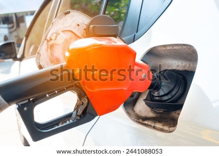 Refuel the car at the refueling point. Energy Concepts Gasoline Gasohol Alternative Energy Royalty-Free Stock Photo #2441088053