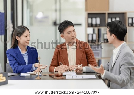 Business lawyer team. Working together in a meeting, cooperation in providing good service, consultation of a business woman and a male lawyer or judge consultant having a team meeting with a client.