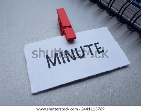 Minute writting on table background.