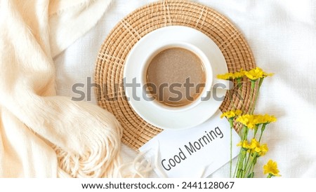 Writing Text Good Morning on notepad.  Take Care for healthy life.  Coffee cup for relaxation  and break time with  flower, top view.  Lifestyle Health Concept
