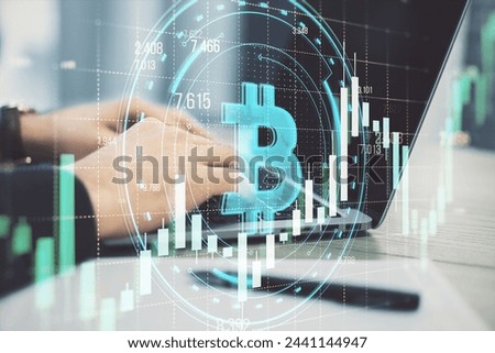 Close up of male hands using laptop with creative round bitcoin hologram on blurry grid background with forex chart. Online banking, cryptocurrency and finance concept. Double exposure