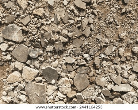 the rough surface of gravel or crushed stone that has been processed and crushed is called split gravel, paving layers, building materials, home and garden yard layers, rock backgrounds and textures.
 Royalty-Free Stock Photo #2441164253