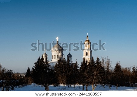 Trinity Cathedral in Diveevo Russia, chapel and bell tower against the background of the blue sky. High quality photo