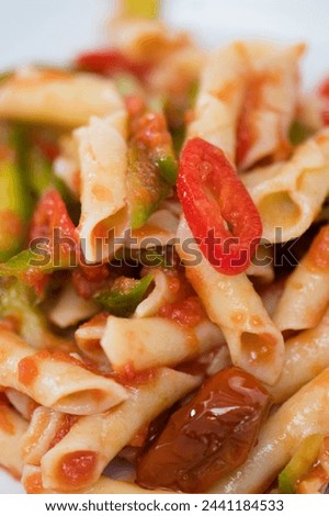 Close-Up of Penne Pasta Served in Plate in 4K Ultra HD Resolution - Stock Photography

