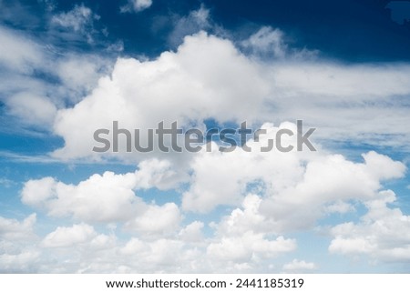 The sky with clouds as a backdrop. Sky in the daytime. Picture in large resolution. White clouds and blue sky. Photo for design and wallpaper.
