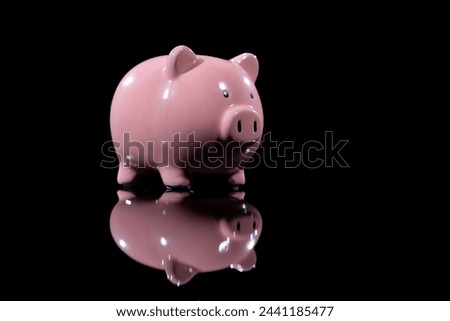 Pink Piggy Bank Burning Against Black Background in 4K Ultra HD Resolution - Stock Footage