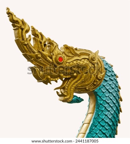 Golden head and green body with red eyes of formidable naga sculpture on white background Royalty-Free Stock Photo #2441187005